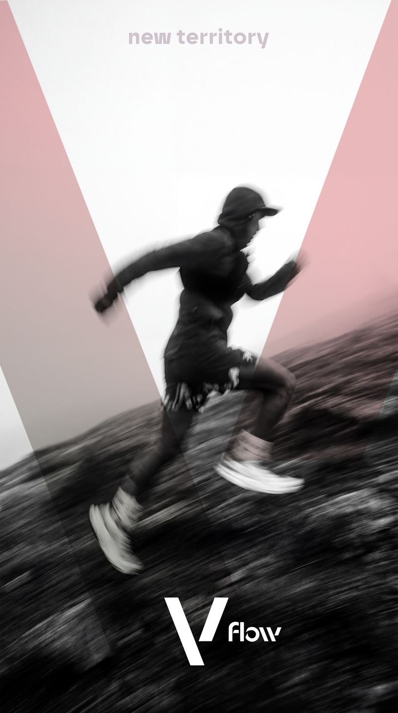 Vflow runner captured mid-stride, leaping across rugged terrain at speed